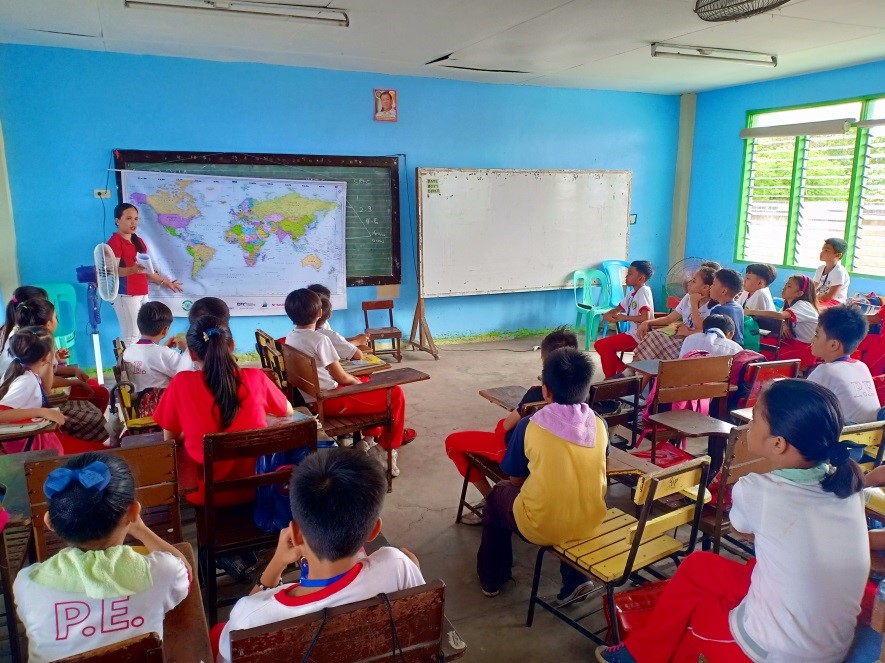 Students using world map