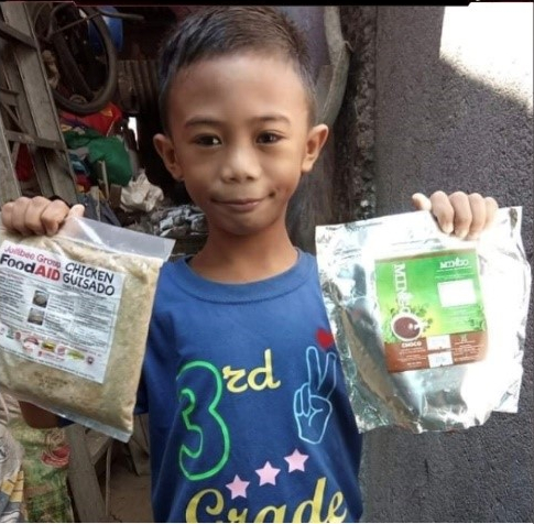 A student holding both donations