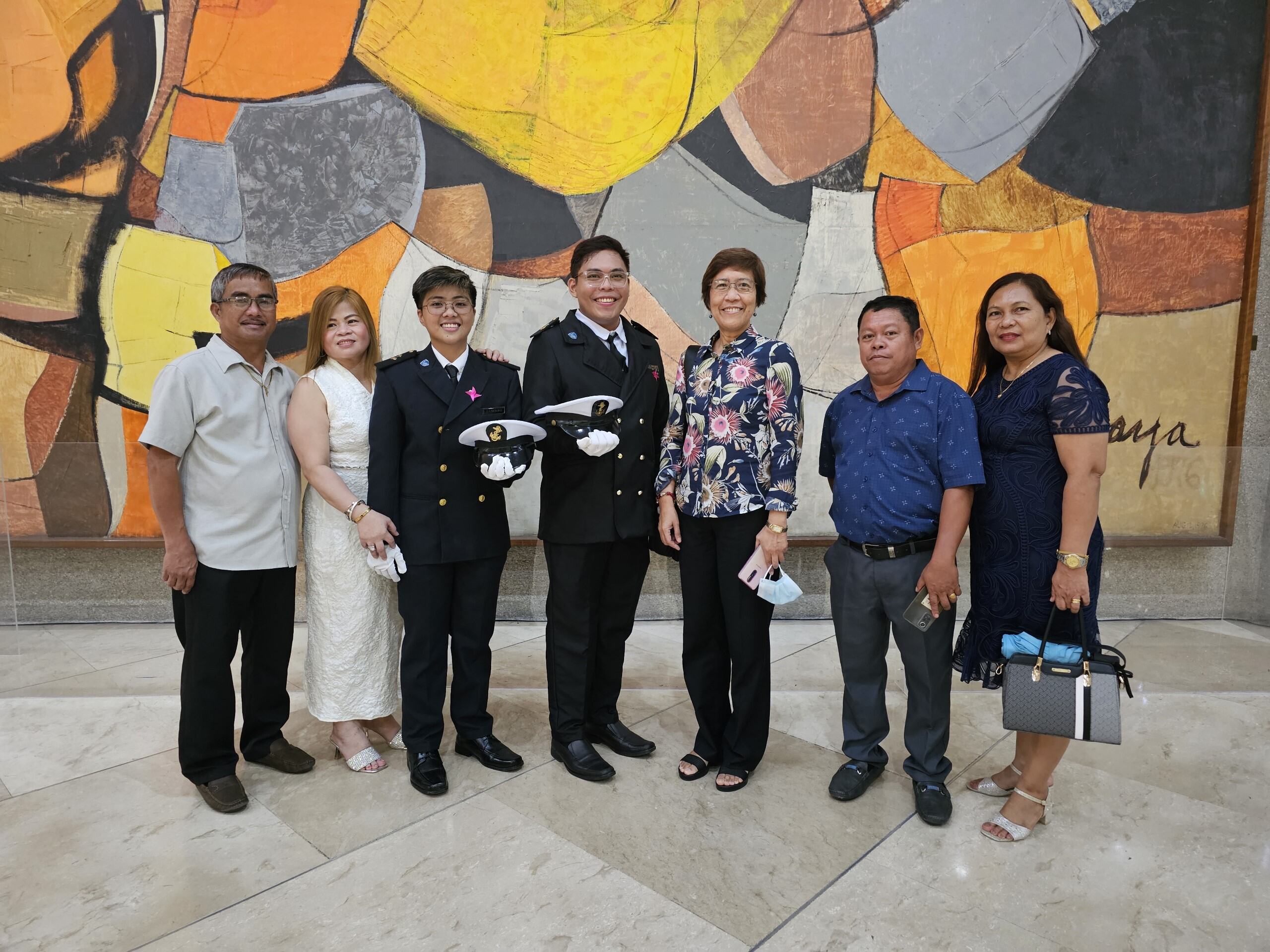 Graduates with Parents and Officials
